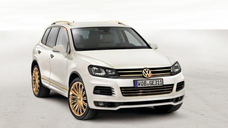 Elegant White Volkswagen SUV with Golden Accents and Stylish Wheels wallpaper