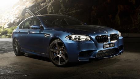 Stunning BMW M5 Sporty Elegance in Dark Setting wallpaper