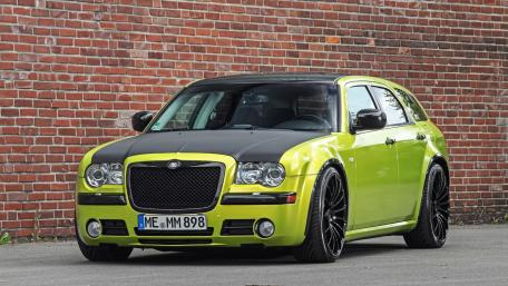 Bold Green and Black Luxury Car Wallpaper wallpaper