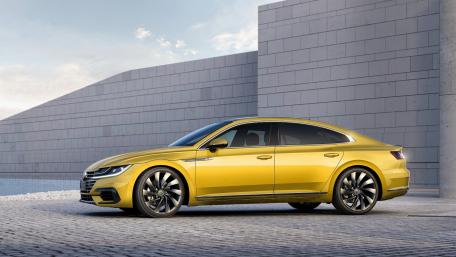 Sleek Yellow Luxury Sedan on Modern Background wallpaper