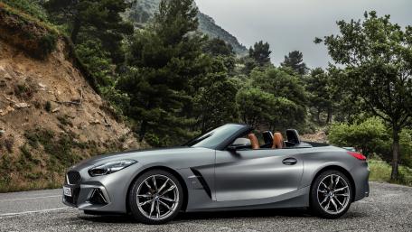 Sleek BMW Cabriolet in Nature's Embrace wallpaper