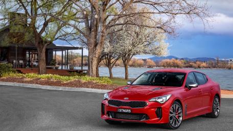 Sleek Red Car by the Lakeside wallpaper