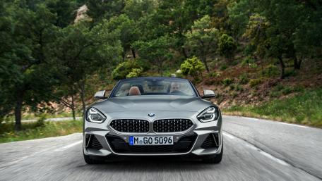 Sleek BMW Cabriolet on a Scenic Drive wallpaper