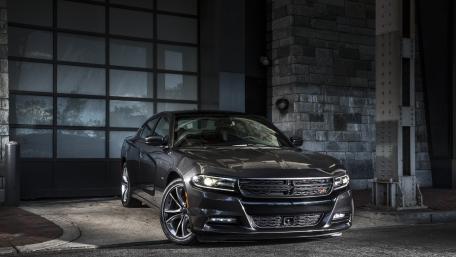 Sleek Dark Charger in Urban Setting wallpaper