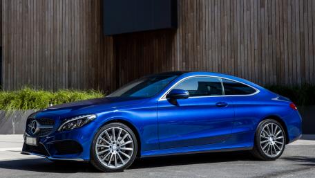 Sleek Blue Sport Coupe Wallpaper wallpaper