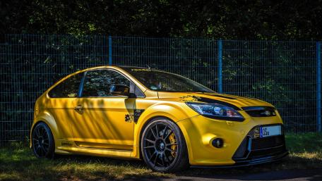 Vibrant Yellow Ford Focus Sport Car Wallpaper wallpaper