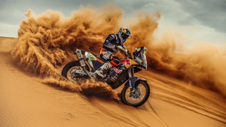 Thrilling Motorcycle Adventure in the Desert Sand wallpaper