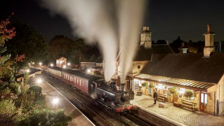 Vintage Steam Train at Night Station Scene wallpaper