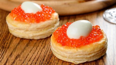 Delightful Pastry Topped with Vibrant Caviar and Egg Treats wallpaper