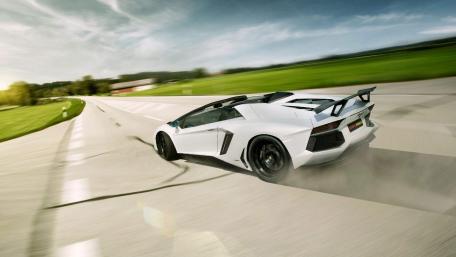 Sleek White Lamborghini Aventador in Motion wallpaper