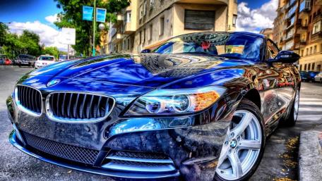 Sleek BMW Amid Urban Landscape wallpaper