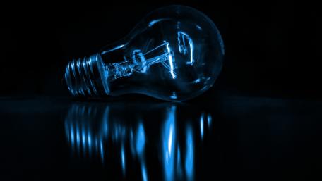 Blue Illuminated Light Bulb wallpaper