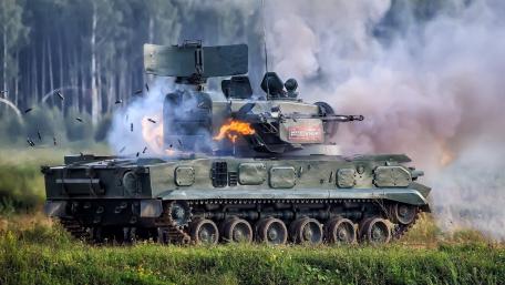 Dynamic Tank in Action with Explosions Surrounding it wallpaper