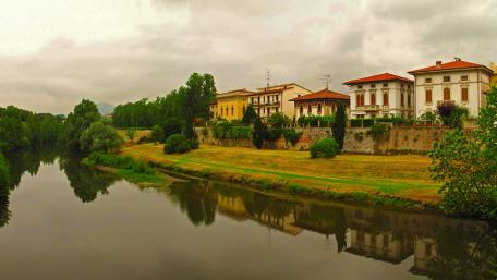 Tranquil Riverfront Scene in a Charming City wallpaper