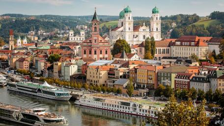 Charming Riverfront Cityscape with Historic Architecture wallpaper