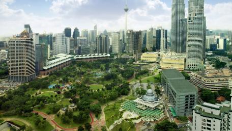 Urban Oasis Amidst Skyscrapers Aerial View wallpaper