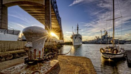 Serene Harbor at Dusk with Docked Vessels wallpaper