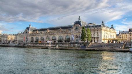 Elegant Landscape of a Classic Parisian Building by the Seine River wallpaper