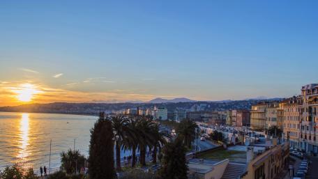Sunset Over the Cityscape by the Sea wallpaper