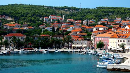 Charming Coastal Village with Vibrant Rooftops wallpaper