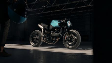 Sleek Motorcycle in Dramatic Lighting for Enthusiasts wallpaper