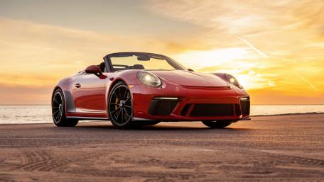 Sleek Red Porsche Cabriolet at Sunset wallpaper