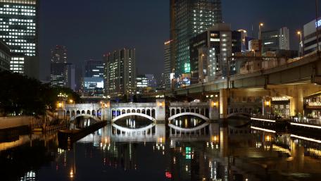 City Lights Reflected in Water at Night wallpaper