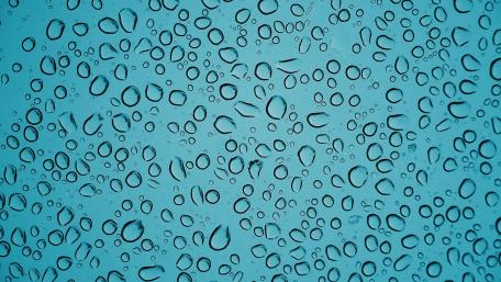 Blue Waterdrops on a Tranquil Surface wallpaper