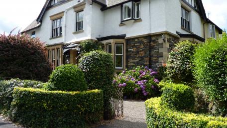 Charming Garden View of a Cozy Home wallpaper