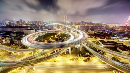 Urban Nightscape with Dynamic Overpass Lights wallpaper