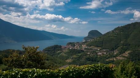 Breathtaking View of Serene Lakeside Village in 4K Quality wallpaper