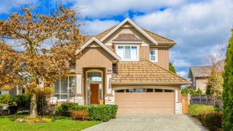 Charming Suburban Home Under a Bright Sky wallpaper