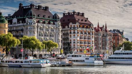 Charming Waterfront Architecture in a Vibrant Cityscape wallpaper