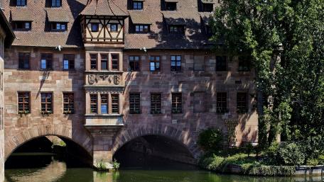 Charming Architecture Reflected in Serene Waters wallpaper