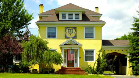 Charming Yellow House in the Cityscape wallpaper