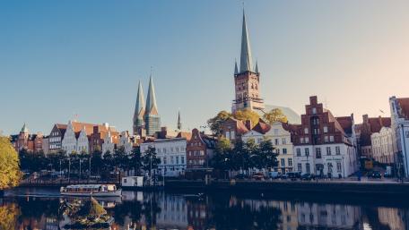 Lübeck's Scenic Riverfront Cityscape Viewpoints wallpaper
