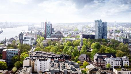 Vibrant Cityscape with Lush Greenery wallpaper