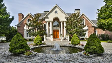 Elegant Cottage with Serene Fountain Landscape wallpaper