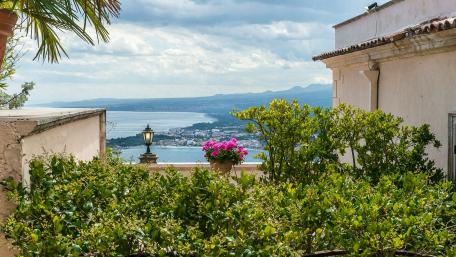 Serene Coastal City View with Lush Greenery wallpaper