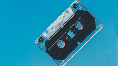 Retro Cassette Tape Against Blue Sky wallpaper
