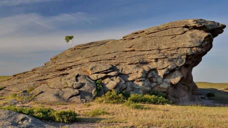Majestic Rock Formation with Lone Tree wallpaper
