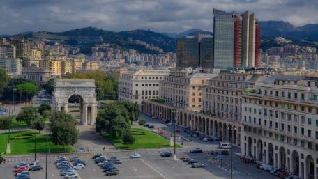 Modern Cityscape with Historical Architecture and Mountains wallpaper