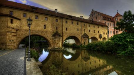 Charming Historic City Reflection in Water wallpaper