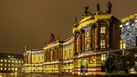 Vibrant City Lights Illuminating Historic Architecture wallpaper