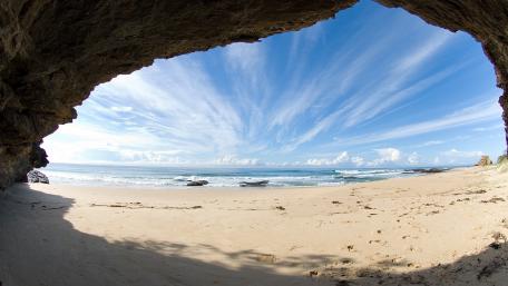 Serene View from a Coastal Cave wallpaper