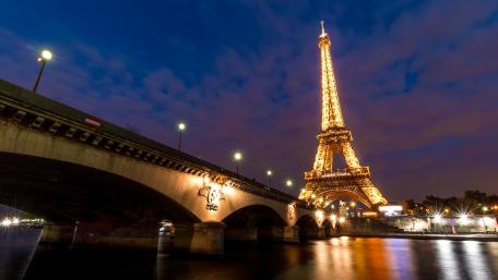 Eiffel Tower Illuminated Over Seine River at Night wallpaper