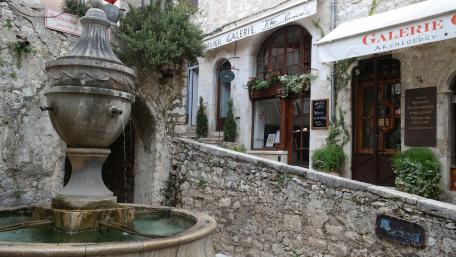 Charming European Village with Fountain and Boutique Gallery wallpaper