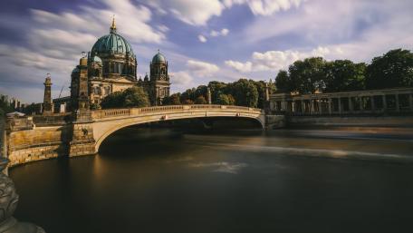 Majestic Cityscape with Iconic Bridge and Historic Architecture wallpaper
