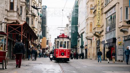Charming City Tram in Urban Setting wallpaper