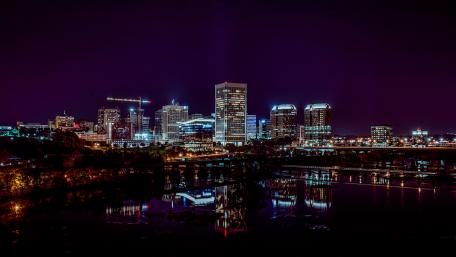 Vibrant City Lights Under a Starry Night Sky wallpaper